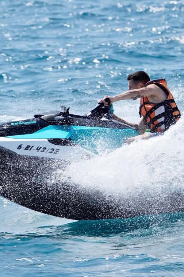 Person riding a jet ski in the ocean